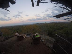  beer on top rock as the sun sets